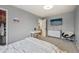 Spacious bedroom featuring neutral walls, a large bed, vanity and a closet at 19707 E Caspian Cir, Aurora, CO 80013