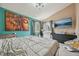 Bright bedroom featuring neutral tones, vaulted ceilings, and a large art piece above the bed at 19707 E Caspian Cir, Aurora, CO 80013