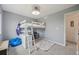 Stylish bedroom with loft bed, study area, and ample natural light at 19707 E Caspian Cir, Aurora, CO 80013