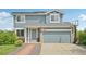 Charming two-story home with a stone accents, a basketball hoop and a well-maintained yard at 19707 E Caspian Cir, Aurora, CO 80013