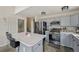 Updated kitchen featuring stainless appliances, gas range, and a center island at 19707 E Caspian Cir, Aurora, CO 80013