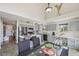 Eat-in kitchen boasting stainless appliances, gray cabinets and an island with seating at 19707 E Caspian Cir, Aurora, CO 80013