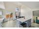 Bright kitchen with a center island, access to the patio, and stylish decor at 19707 E Caspian Cir, Aurora, CO 80013