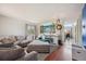 Comfortable living room with a large sectional, modern lighting, and decorative accents at 19707 E Caspian Cir, Aurora, CO 80013