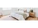 Bright bedroom features a large bed with decorative pillows and two stylish nightstands at 6211 W Fremont Pl, Littleton, CO 80128