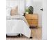 Cozy bedroom detail with a plush bed, stylish nightstand, and ample natural light at 6211 W Fremont Pl, Littleton, CO 80128