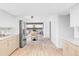 Open kitchen with stainless steel appliances and modern cabinetry, seamlessly connected to the adjacent living areas at 6211 W Fremont Pl, Littleton, CO 80128