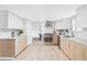 Modern kitchen featuring stainless steel appliances, white countertops, and sleek cabinetry at 6211 W Fremont Pl, Littleton, CO 80128