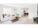 Bright living room featuring stylish furnishings, an open layout, and natural light, perfect for modern living at 6211 W Fremont Pl, Littleton, CO 80128