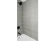 Beautifully tiled shower features modern fixtures and sleek design at 6211 W Fremont Pl, Littleton, CO 80128