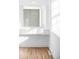 Bright vanity area with white cabinetry, drawers, and ample natural light from nearby window at 6211 W Fremont Pl, Littleton, CO 80128