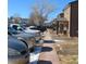 Exterior townhome community view featuring well-maintained landscaping and sidewalks connecting each cozy residence at 473 N Banner St # D, Elizabeth, CO 80107