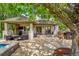 Beautiful back patio with seating, outdoor kitchen, and bar at 7818 S Zeno St, Centennial, CO 80016