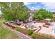 Beautifully landscaped backyard with built-in fire pit and outdoor seating at 7818 S Zeno St, Centennial, CO 80016