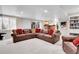 Finished basement with a comfortable seating area and bar at 7818 S Zeno St, Centennial, CO 80016