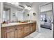 Bathroom with double vanity, granite countertops, and neutral walls at 7818 S Zeno St, Centennial, CO 80016