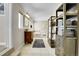 Spacious bathroom featuring a vanity, a soaking tub, a tiled floor, and large shelving units at 7818 S Zeno St, Centennial, CO 80016