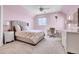 Bedroom featuring soft pink walls, plush carpeting, and ample lighting at 7818 S Zeno St, Centennial, CO 80016