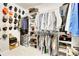 Organized closet with clothing racks, shelving, and hat collection at 7818 S Zeno St, Centennial, CO 80016