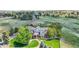 Expansive estate on lush green property featuring mature trees, manicured lawns, and a beautifully designed multi-story home at 7818 S Zeno St, Centennial, CO 80016
