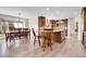 Open concept kitchen with wooden cabinets, large island, breakfast nook and stainless steel appliances at 7818 S Zeno St, Centennial, CO 80016