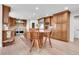 Spacious kitchen featuring wooden cabinetry, stainless steel appliances, and a center island with seating at 7818 S Zeno St, Centennial, CO 80016