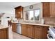 Well-equipped kitchen with custom cabinets, stainless appliances, and granite countertops at 7818 S Zeno St, Centennial, CO 80016