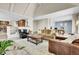 Open living space featuring a fireplace, comfortable seating, and bright lighting at 7818 S Zeno St, Centennial, CO 80016