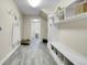 Functional mudroom with built-in storage, bench seating, and stylish tile flooring at 7818 S Zeno St, Centennial, CO 80016