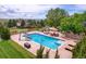 Aerial view of the backyard pool with slide, water features, and lounge area at 7818 S Zeno St, Centennial, CO 80016