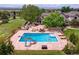 Amazing backyard pool with slide, basketball hoop, and lounge chairs at 7818 S Zeno St, Centennial, CO 80016