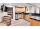 Basement bar with wine cellar, custom cabinetry, and stainless appliances at 7818 S Zeno St, Centennial, CO 80016