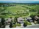 Aerial view of homes near green space, showcasing neighborhood and outdoor recreation areas at 984 Shadow Mountain Dr, Highlands Ranch, CO 80126