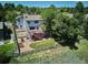 Aerial perspective of backyard featuring a multi-level deck, well-kept landscaping, and privacy fence at 984 Shadow Mountain Dr, Highlands Ranch, CO 80126