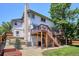 Expansive backyard featuring a spacious deck, lush greenery, and serene outdoor living at 984 Shadow Mountain Dr, Highlands Ranch, CO 80126