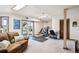 Finished basement area with a brown couch and an exercise space at 984 Shadow Mountain Dr, Highlands Ranch, CO 80126