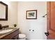 Bathroom features a granite vanity, framed mirror, and a decorative accent picture at 984 Shadow Mountain Dr, Highlands Ranch, CO 80126