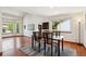 Bright dining room with wood floors, and a large window that gives a pleasant view of the outside at 984 Shadow Mountain Dr, Highlands Ranch, CO 80126