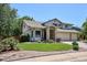 Charming two-story home with well-manicured lawn, mature trees, and three car garage at 984 Shadow Mountain Dr, Highlands Ranch, CO 80126