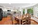 Modern kitchen with stainless steel appliances, island, granite countertops, and white and gray cabinets at 984 Shadow Mountain Dr, Highlands Ranch, CO 80126