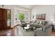 Comfortable living room with bay window, modern furnishings, and stylish decor at 984 Shadow Mountain Dr, Highlands Ranch, CO 80126