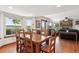 Open floor plan with dining area, fireplace, and views of the surrounding greenery at 984 Shadow Mountain Dr, Highlands Ranch, CO 80126