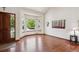 Inviting living room features a large bay window, wood floors, and ample natural light at 984 Shadow Mountain Dr, Highlands Ranch, CO 80126