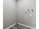 Basement hookups for Washer and Dryer with grey wood-look floors at 1777 S Pitkin St # A, Aurora, CO 80017