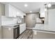 Bright kitchen with stainless steel appliances, modern cabinets, and granite countertops at 1777 S Pitkin St # A, Aurora, CO 80017