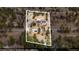 Aerial view of the property, highlighting its location, surrounding trees, and access road at 248 Copperdale Ln, Golden, CO 80403