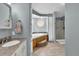Bathroom with tub, standing shower, sink with granite counters, and tile flooring at 248 Copperdale Ln, Golden, CO 80403