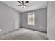 Neutral bedroom features a modern ceiling fan and one window at 248 Copperdale Ln, Golden, CO 80403