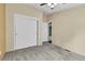 Bedroom featuring neutral carpet, closet, and a door to another room at 248 Copperdale Ln, Golden, CO 80403