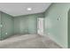 Light-green bedroom with gray carpet features a recessed ceiling light and white trim at 248 Copperdale Ln, Golden, CO 80403